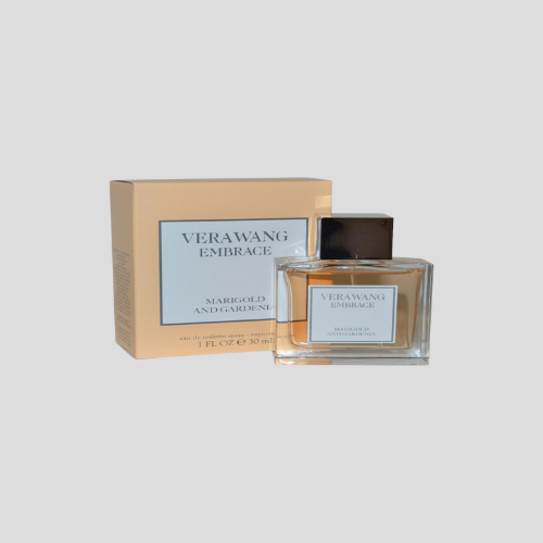 A 30ml bottle of Vera Wang Embrace Eau de Toilette Spray, showcasing an elegant, transparent bottle with a floral design and gold accents. The fragrance mist is light and fresh, embodying the essence of marigold and gardenia. The label features the Vera Wang logo and product name, set against a soft floral background that emphasizes the fragrance's delicate and feminine appeal.