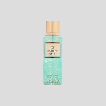 A 250ml bottle of Victoria's Secret Seaside Surf Fragrance Mist, featuring a sleek transparent bottle with ocean-inspired design elements. The mist is light blue in color, evoking the feeling of a cool sea breeze. The label showcases beachy patterns, and the bottle is displayed against a bright, airy background to enhance its fresh, summery appeal.

